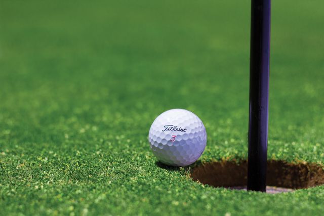 golfball%20sitting%20next%20to%20hole